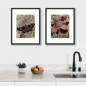 2 moth art prints with plants hanging on wall above kitchen sink