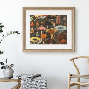 art print of vintage mushrooms in grass hanging on wall above chair and bench