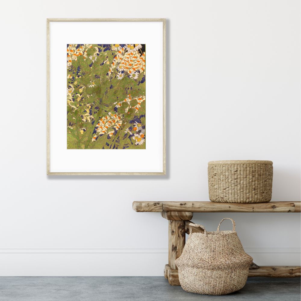 abstract flower art poster in greens and oranges framed on wall above bench and baskets