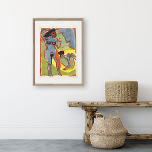 vintage art poster of bathing women in bright colors hanging on wall above bench