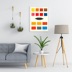 art print of color study swatches hanging on wall above side table