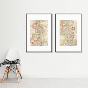 2 vintage map art prints in frames on wall