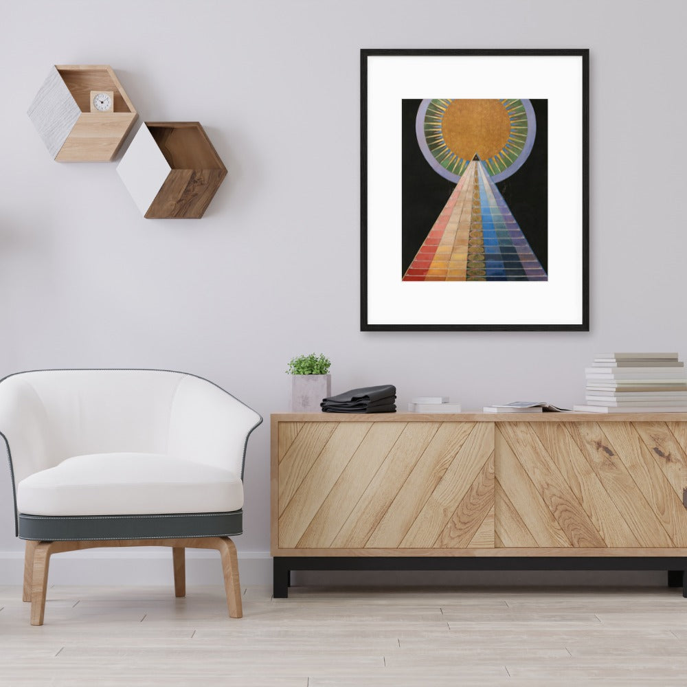 rainbow abstract art poster in black frame hanging above sideboard 