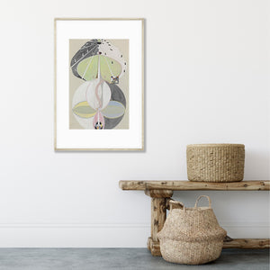 pale neutral hilma af klint abstract art poster hanging in a frame above a wood bench and 2 baskets